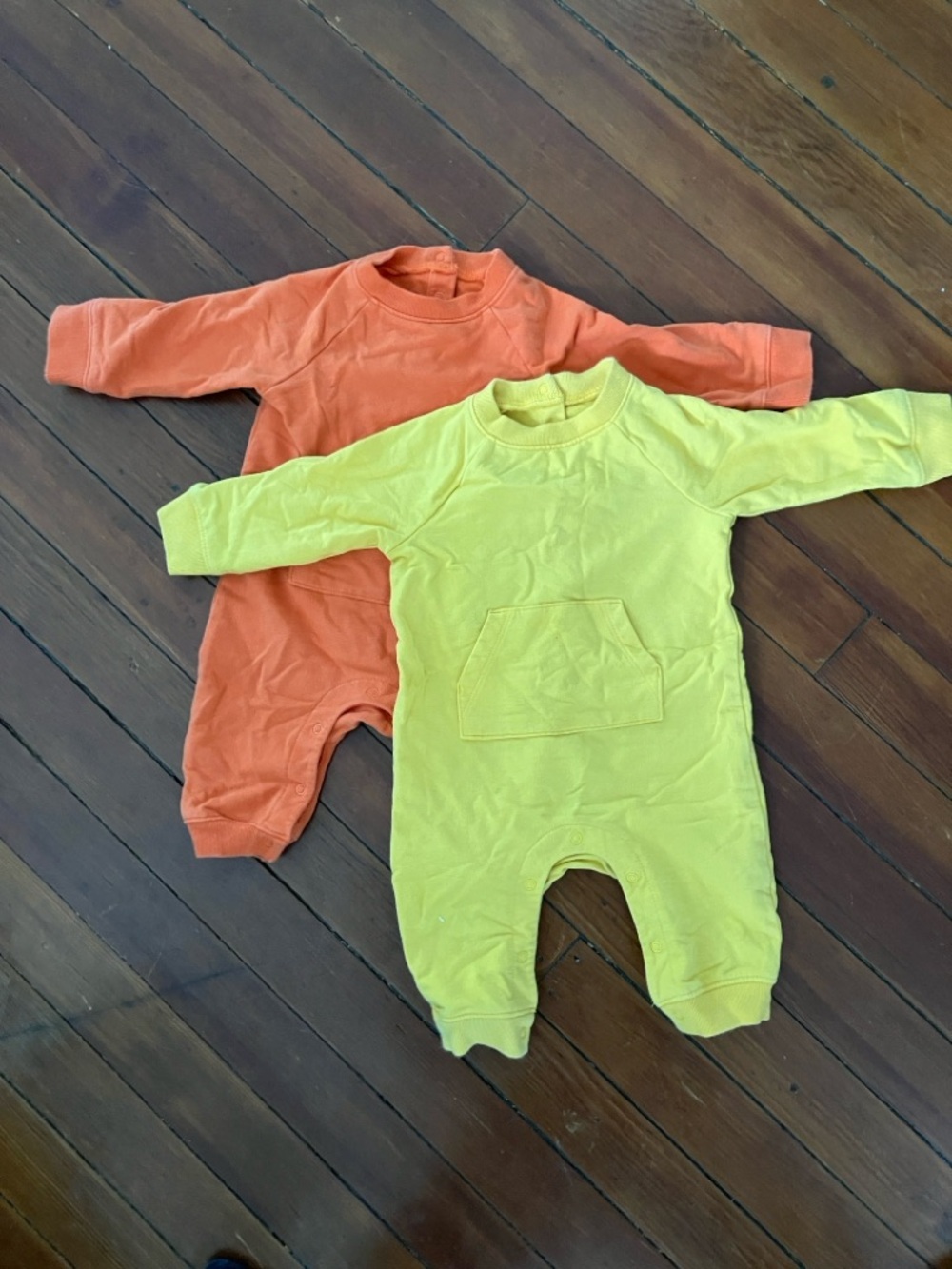 Two Primary sweatshirt Long-Sleeve One-Piece Rompers in Yellow and Orange